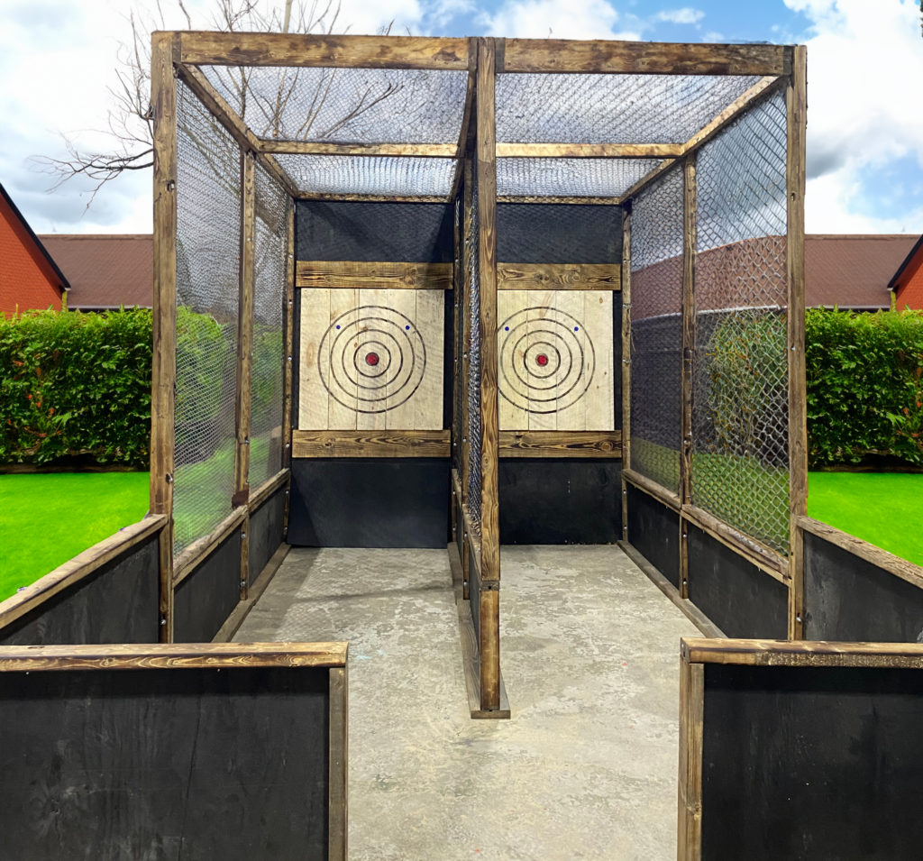 Full enclosed outdoor axe throwing lanes made out of wood with bullseye targets